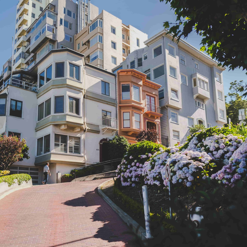 vertical-shot-modern-apartments-daytime-min vertical-shot-modern-apartments-daytime-min